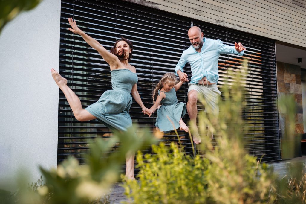 Portrait of a happy family having fun and spending time together outdoors.