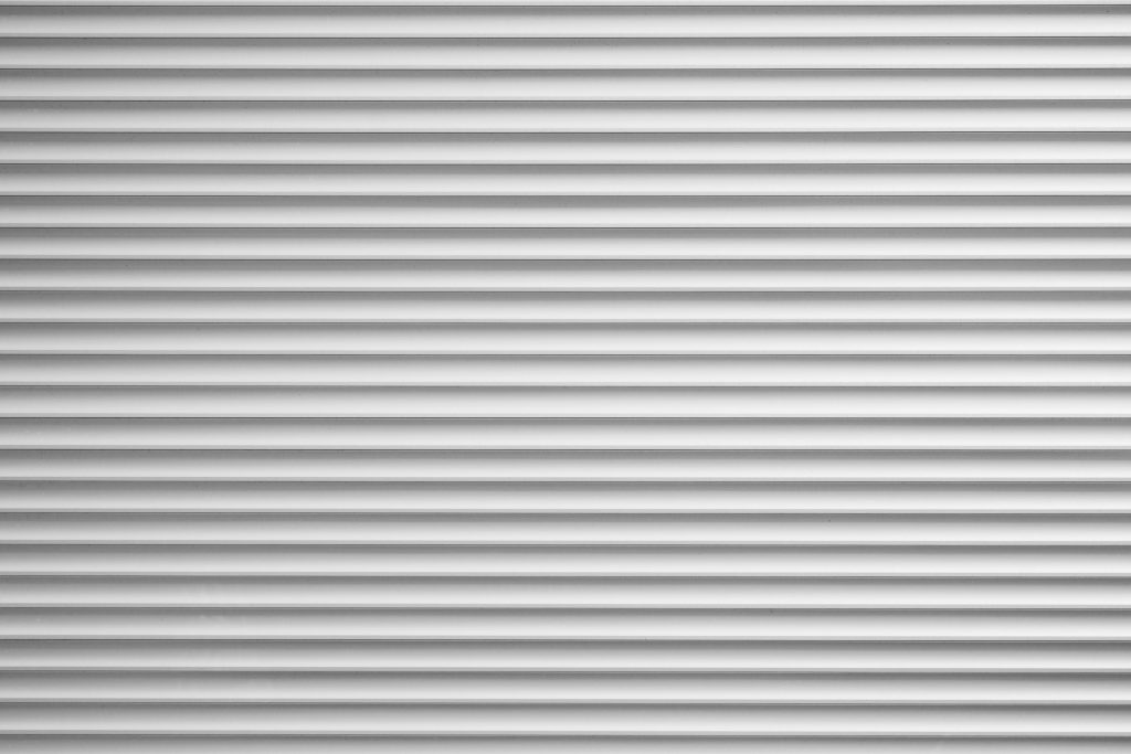silver metallic roller blind or sliding shutter shade background with copy space