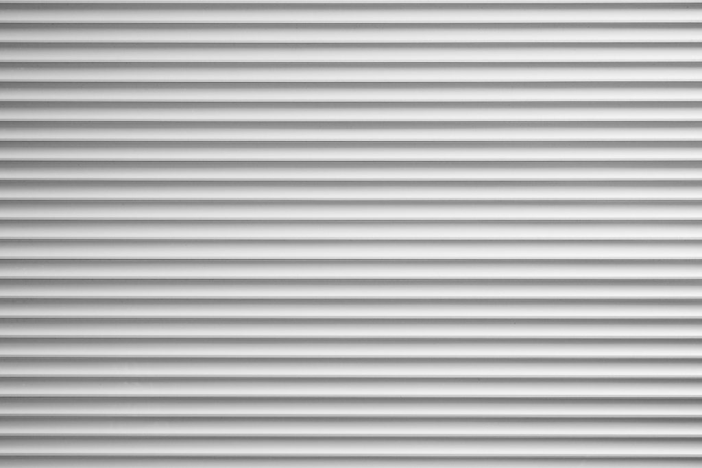 silver metallic roller blind or sliding shutter shade background with copy space